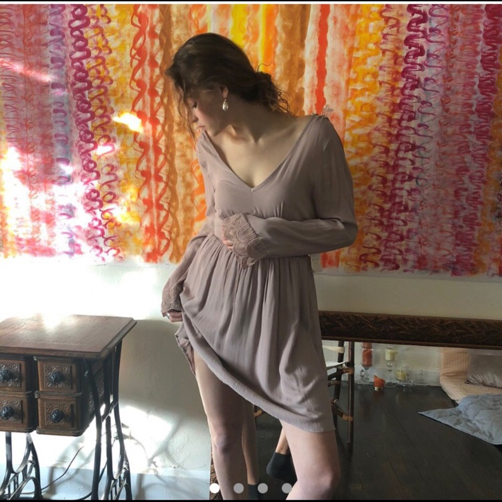 Alter’d State short mauve colored dress with long lace detailed sleeves.